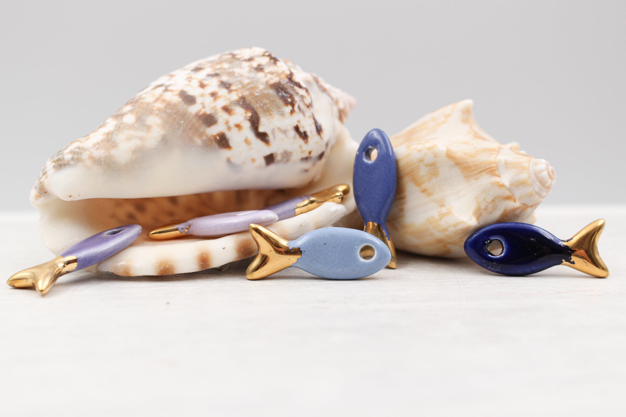 Ceramic and Gold Fish Charms for Jewelry and accessories making handmade in France by Alain Granell