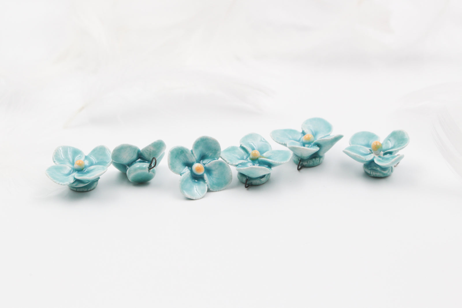Handmade ceramic clovers for jewelry and accessories making