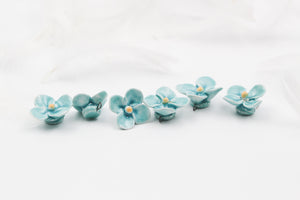 Handmade ceramic clovers for jewelry and accessories making