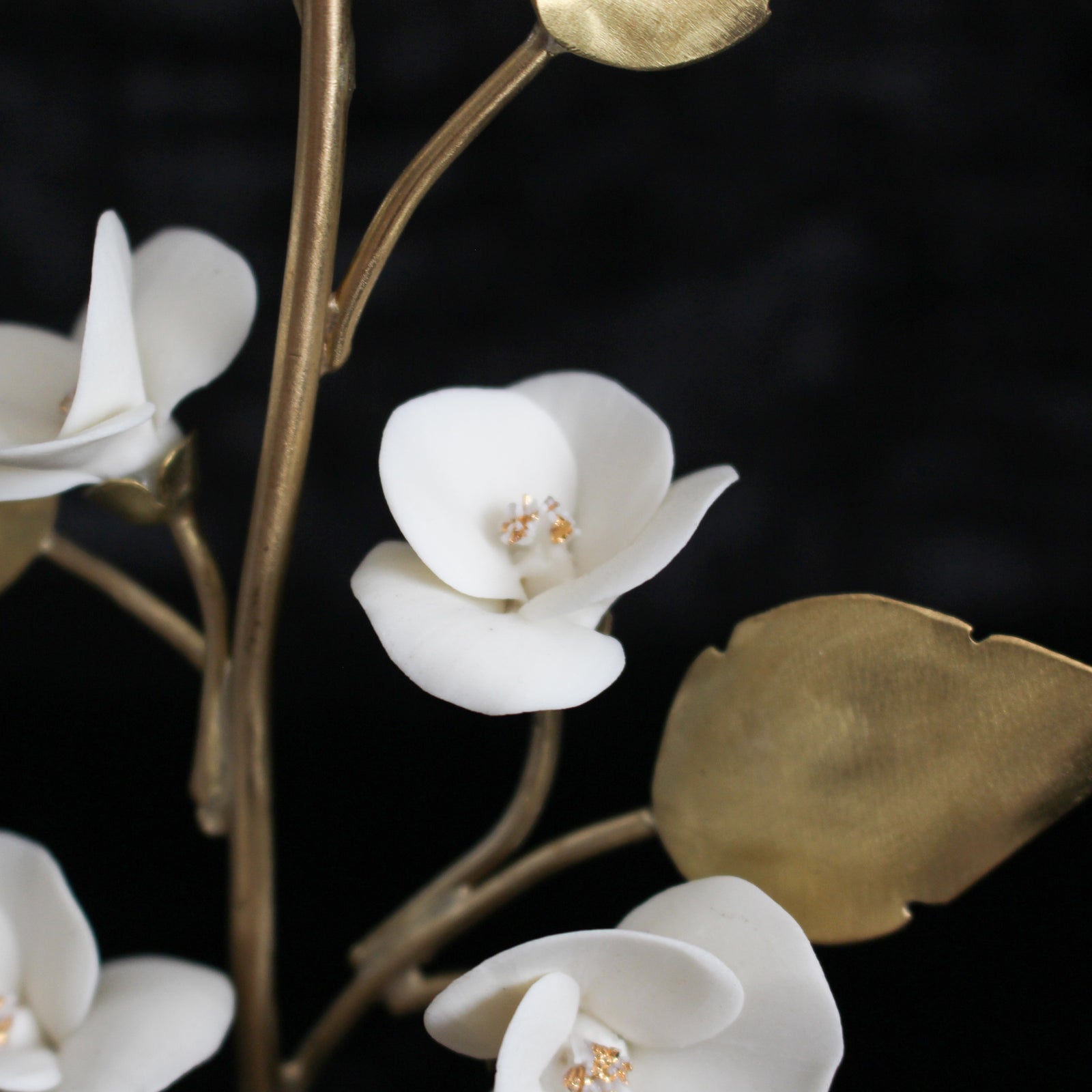White porcelain flowers on Brass Tree by Alain Granell