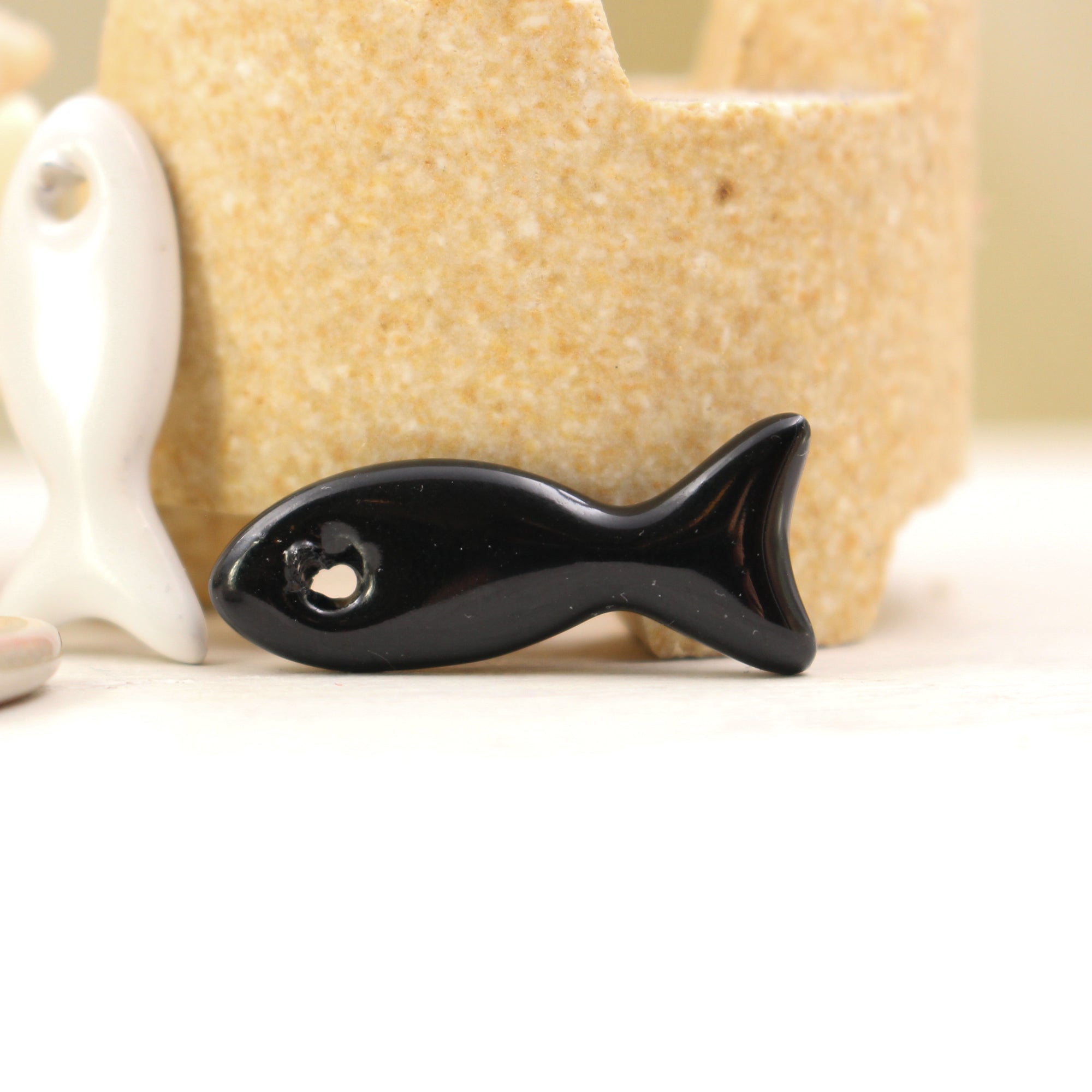 Ceramic fish charms for jewelry and accessories handmade in France by Alain Granell