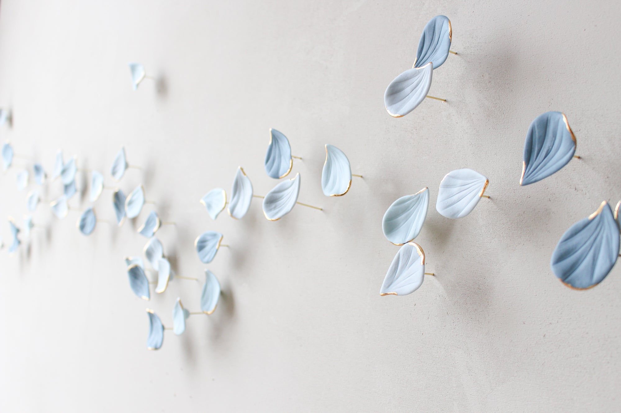 Blue Autumn is a Large porcelain wall art of Blue Leaves handmade in France by Alain Granell