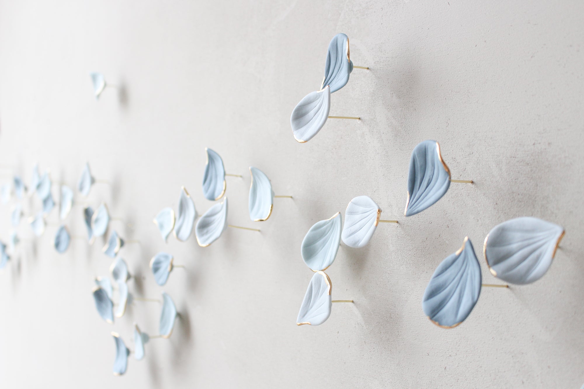 Blue Autumn is a Large porcelain wall art of Blue Leaves handmade in France by Alain Granell