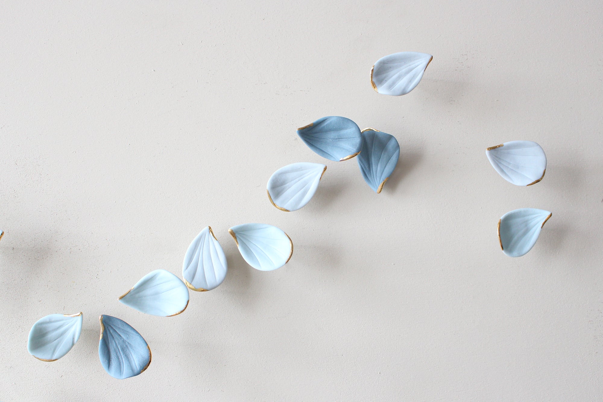 Blue Autumn is a Large porcelain wall art of Blue Leaves handmade in France by Alain Granell