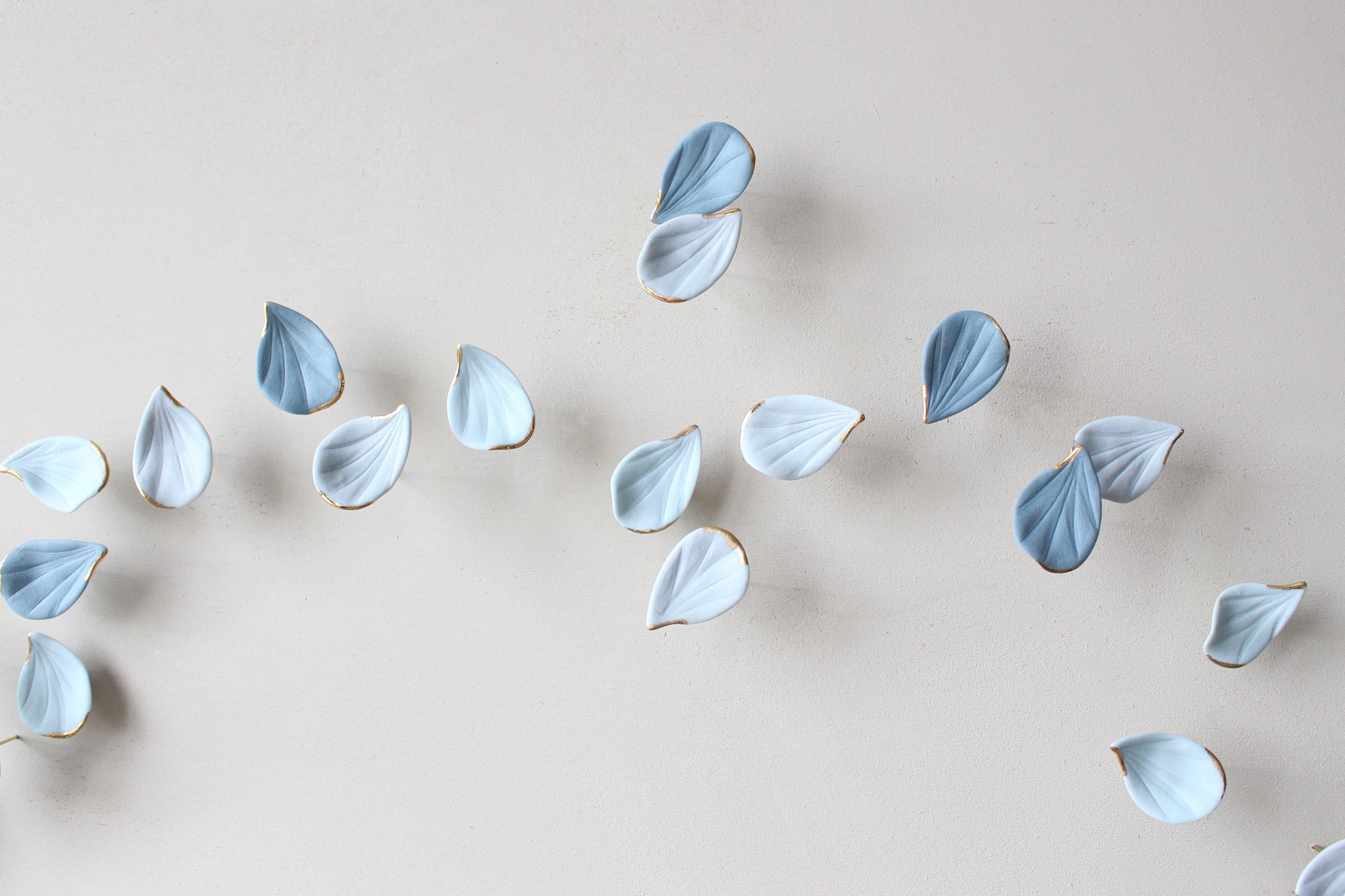 Blue Autumn is a Large porcelain wall art of Blue Leaves handmade in France by Alain Granell
