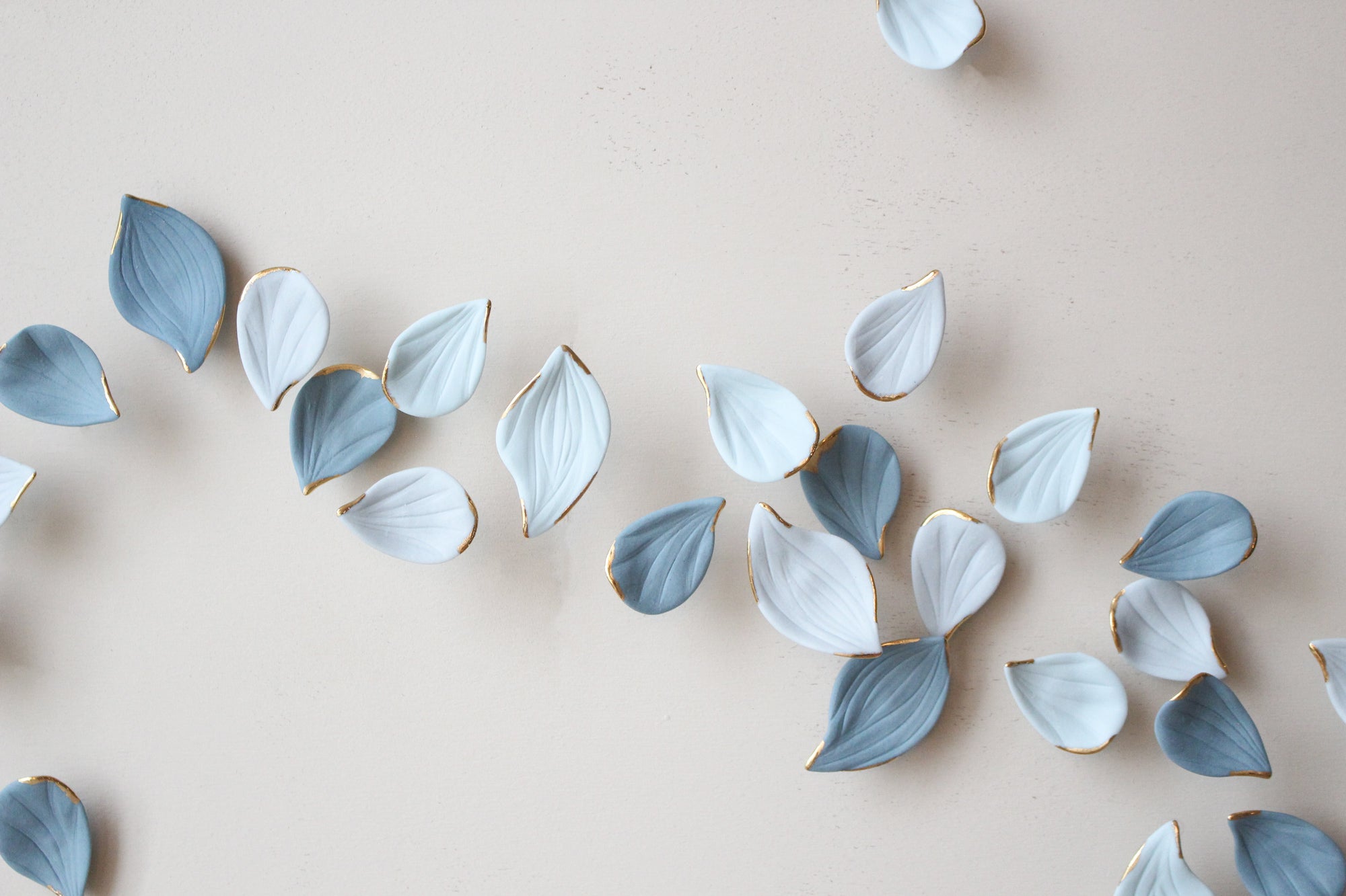 Blue Autumn is a Large porcelain wall art of Blue Leaves handmade in France by Alain Granell