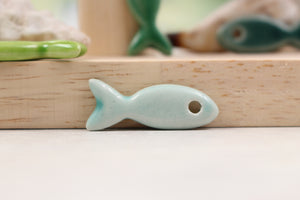 Ceramic fish charms for jewelry and accessories handmade in France by Alain Granell