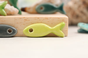 Ceramic fish charms for jewelry and accessories handmade in France by Alain Granell