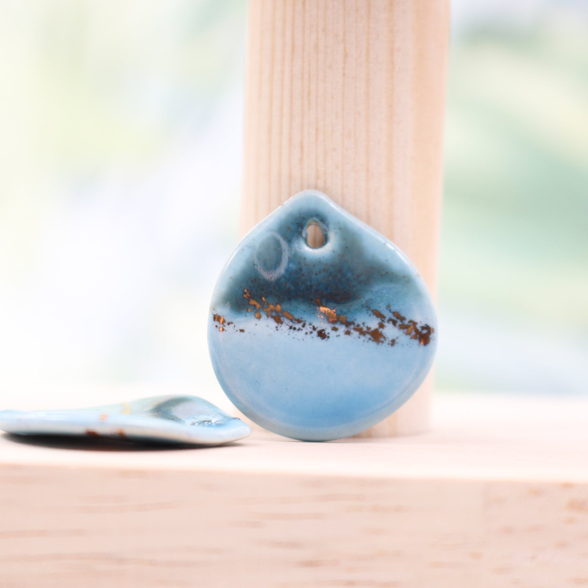 Multicolor ceramic and gold petal charms handmade in France by Alain Granell