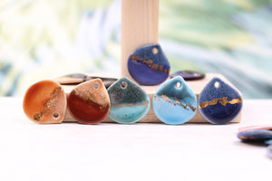 Multicolor ceramic and gold petal charms handmade in France by Alain Granell
