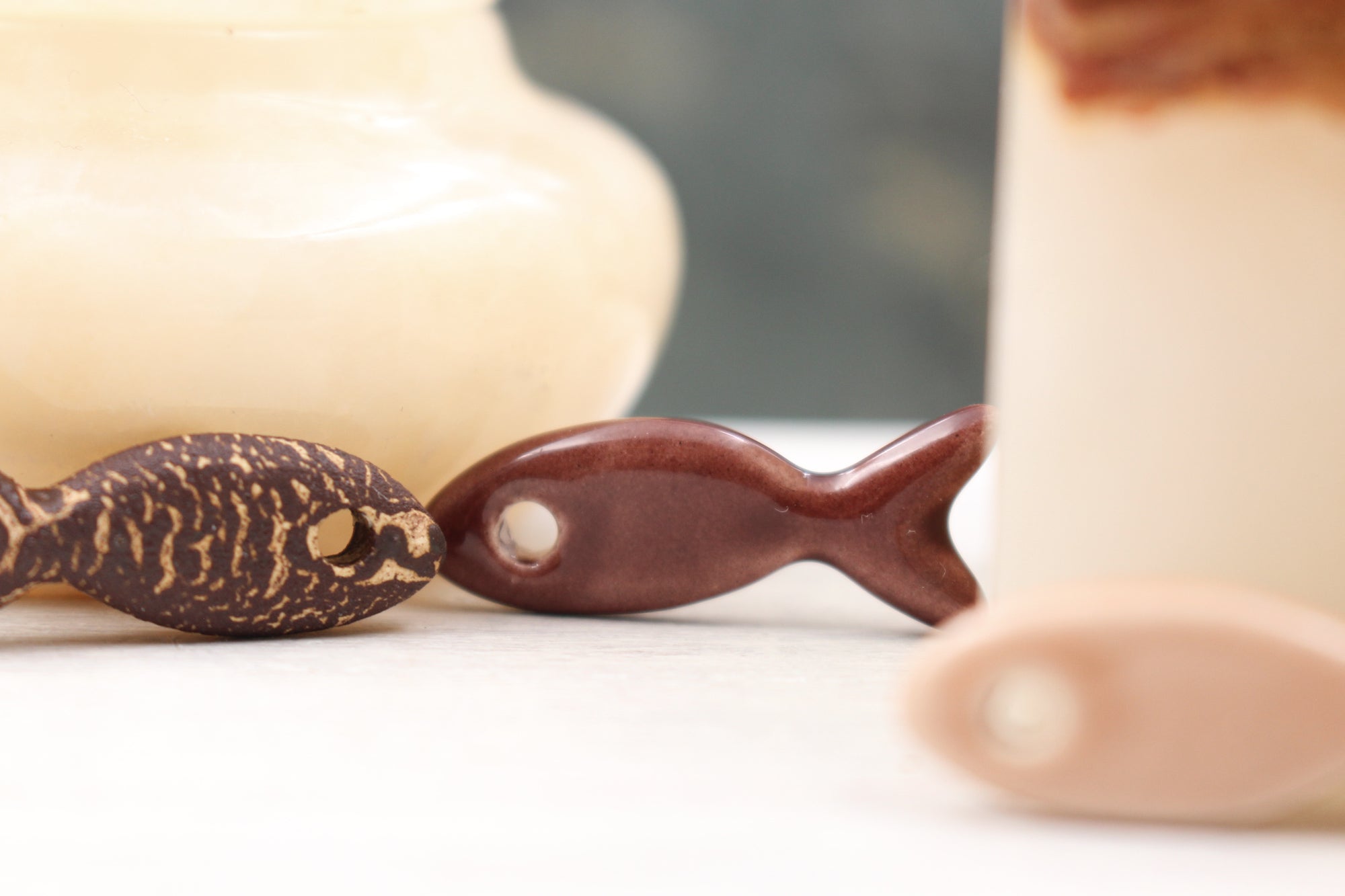 Ceramic fish charms for jewelry and accessories handmade in France by Alain Granell