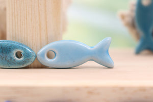 Ceramic fish charms for jewelry and accessories handmade in France by Alain Granell
