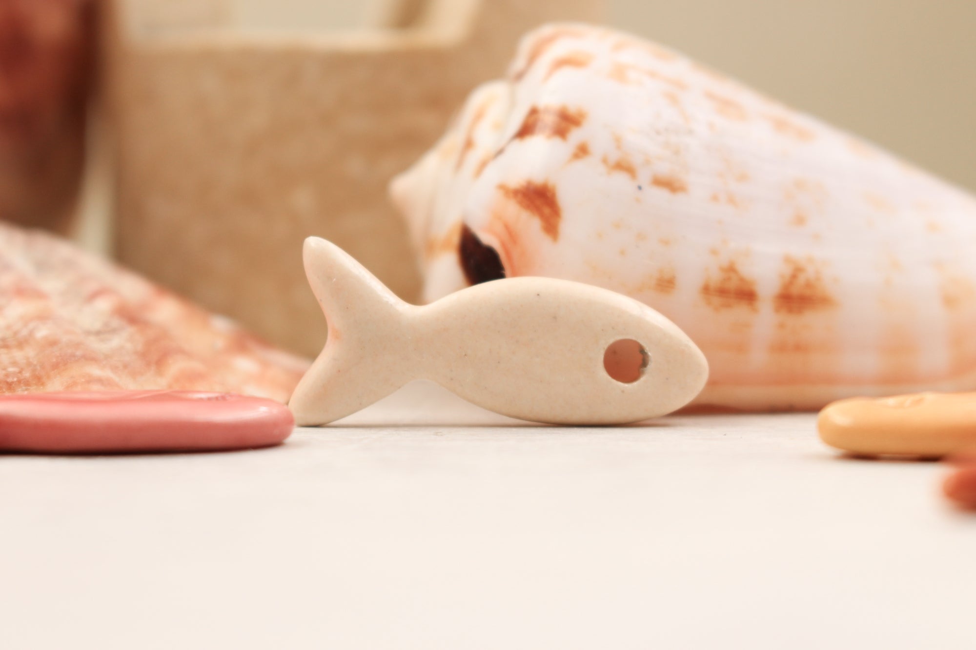 Ceramic fish charms for jewelry and accessories handmade in France by Alain Granell