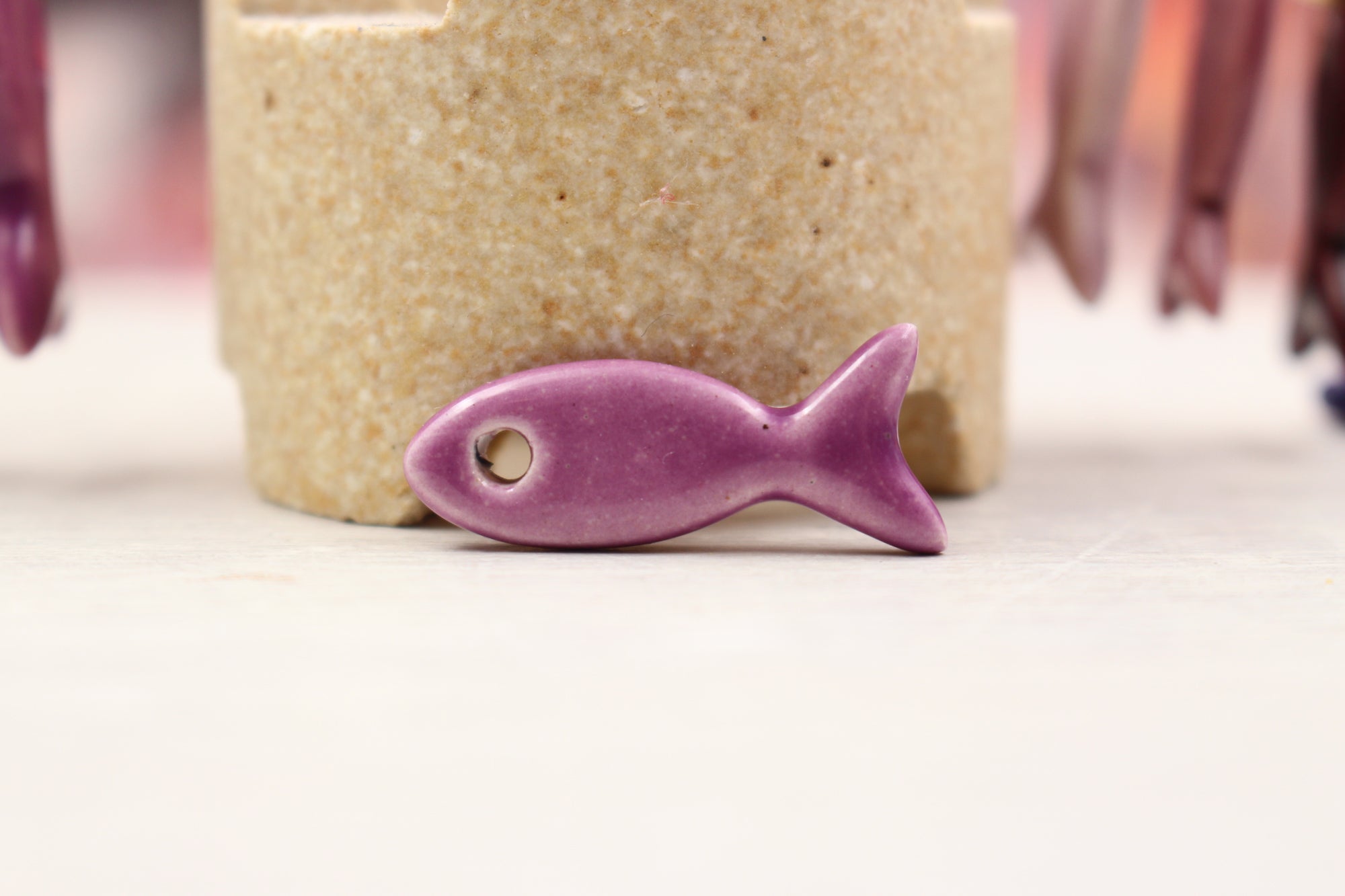 Ceramic fish charms for jewelry and accessories handmade in France by Alain Granell