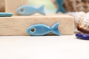 Ceramic fish charms for jewelry and accessories handmade in France by Alain Granell