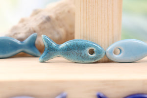 Ceramic fish charms for jewelry and accessories handmade in France by Alain Granell