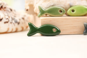 Ceramic fish charms for jewelry and accessories handmade in France by Alain Granell