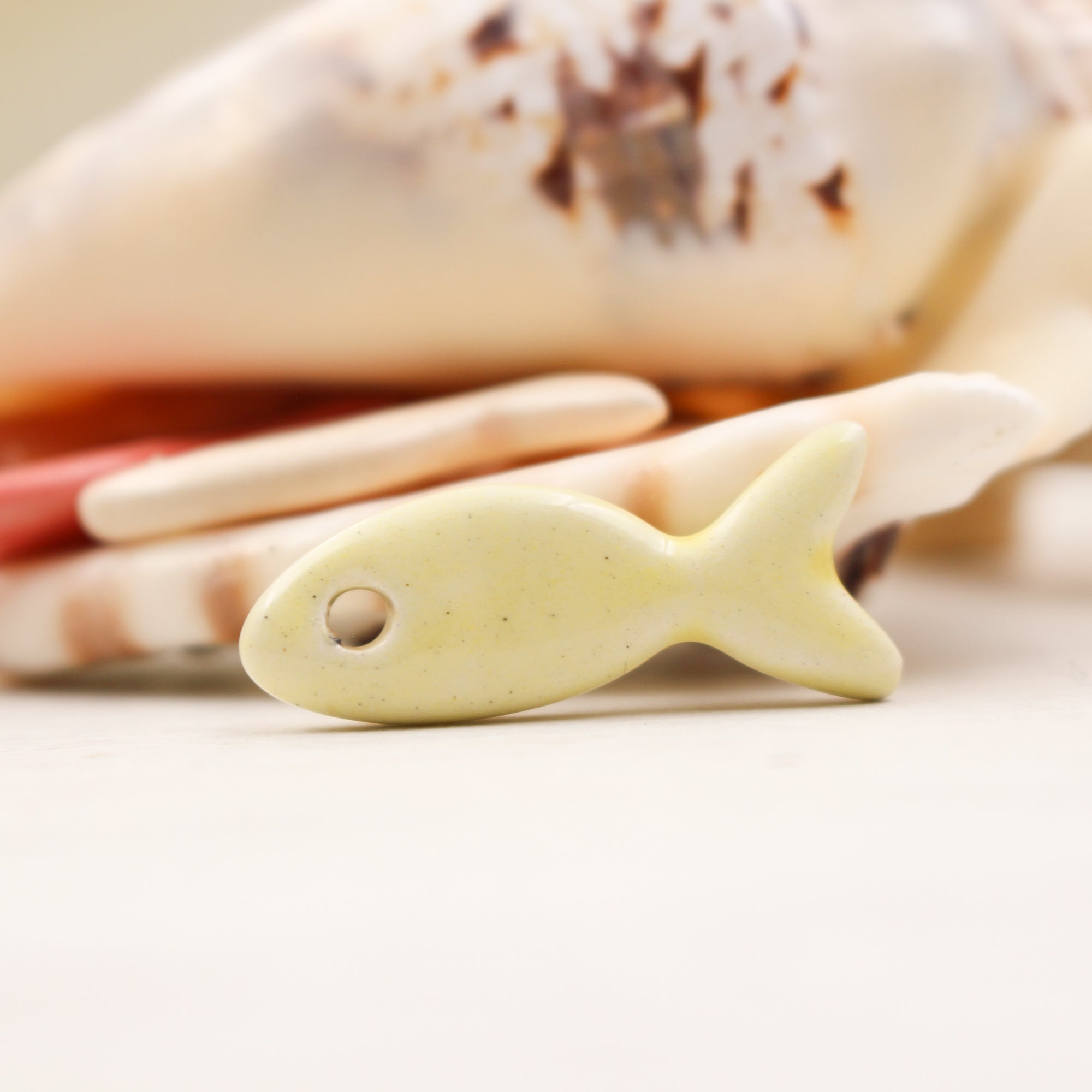 Ceramic fish charms for jewelry and accessories handmade in France by Alain Granell