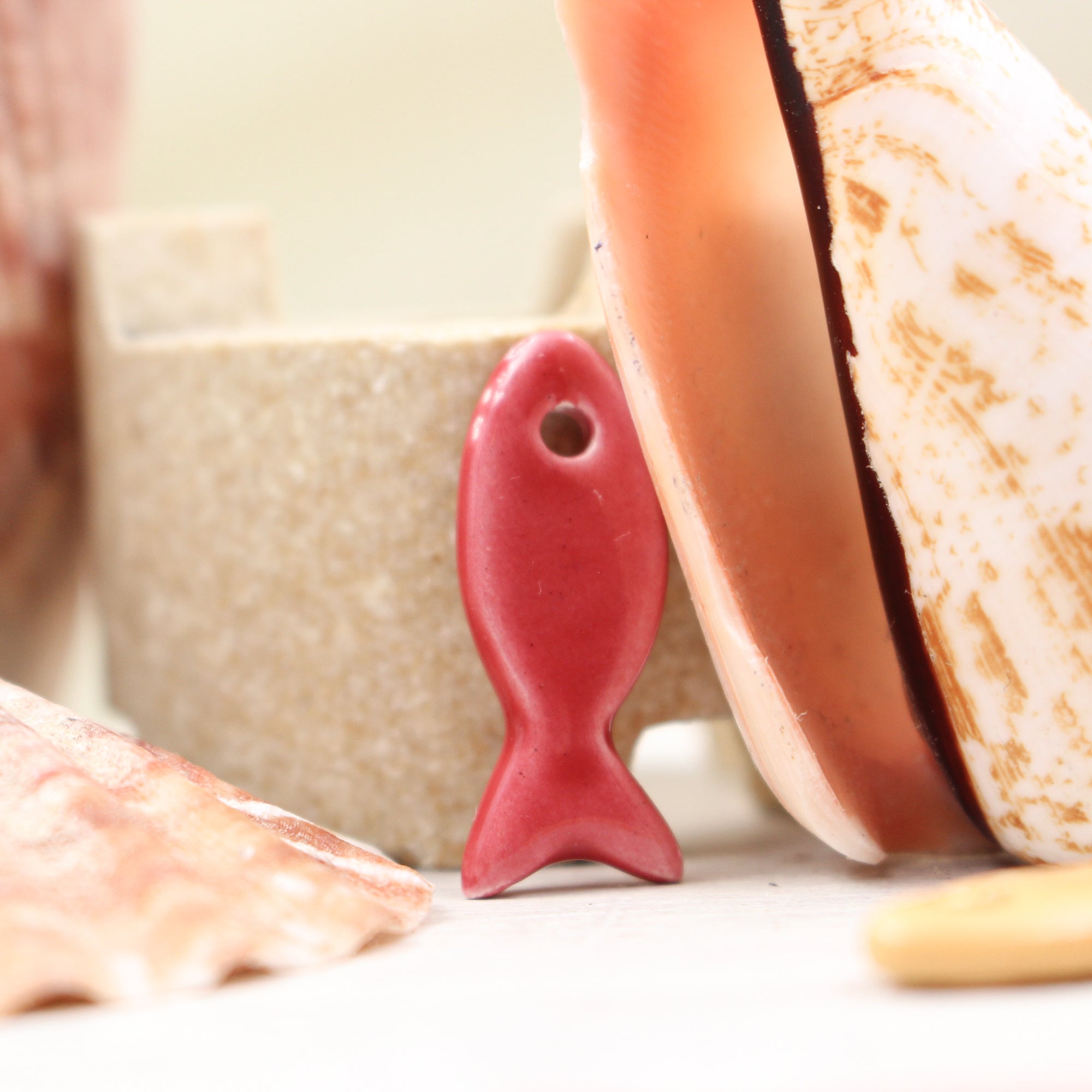 Ceramic fish charms for jewelry and accessories handmade in France by Alain Granell