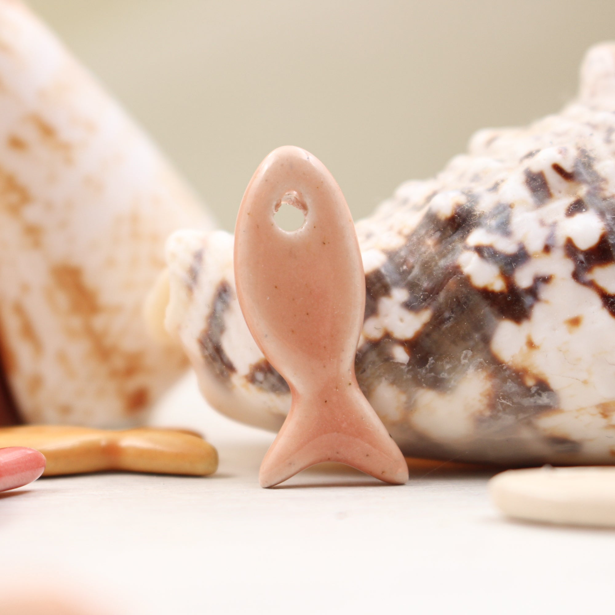 Ceramic fish charms for jewelry and accessories handmade in France by Alain Granell
