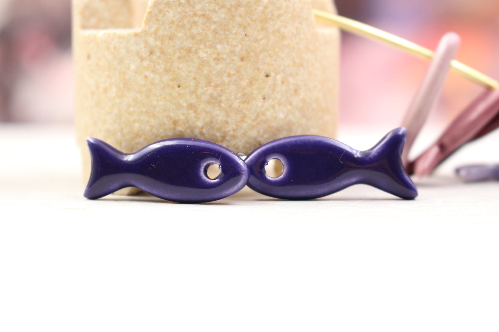 Ceramic fish charms for jewelry and accessories handmade in France by Alain Granell