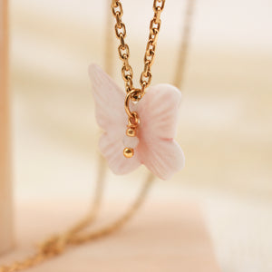 Collier acier inoxydable et papillon rose en porcelaine