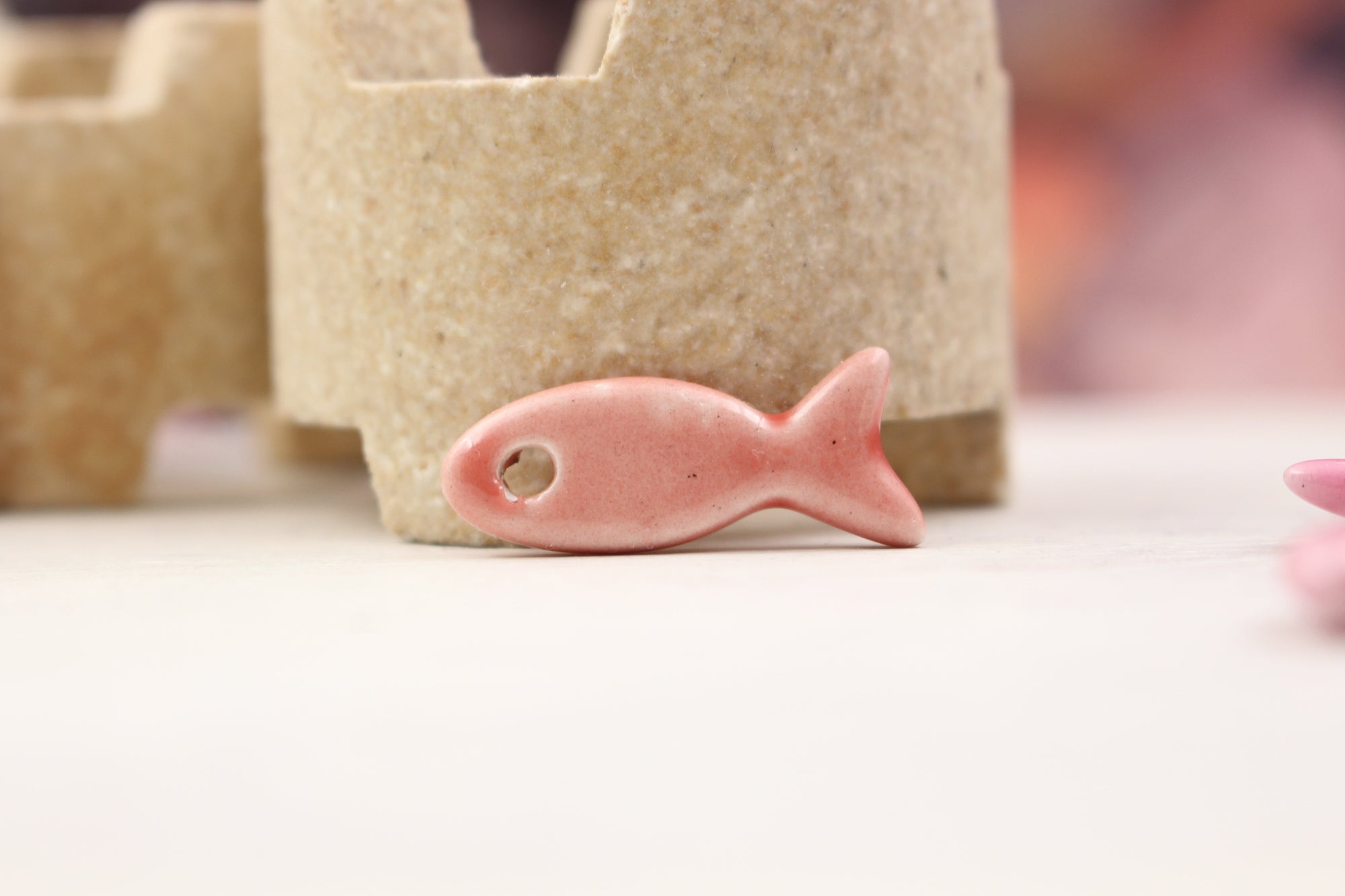 Ceramic fish charms for jewelry and accessories handmade in France by Alain Granell
