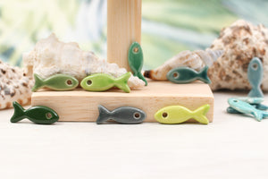 Ceramic fish charms for jewelry and accessories handmade in France by Alain Granell