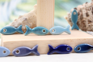 Ceramic fish charms for jewelry and accessories handmade in France by Alain Granell