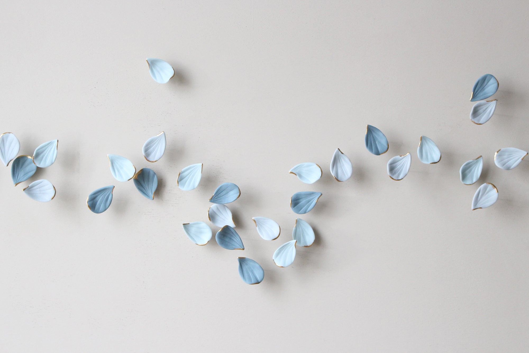 Blue Autumn is a Large porcelain wall art of Blue Leaves handmade in France by Alain Granell
