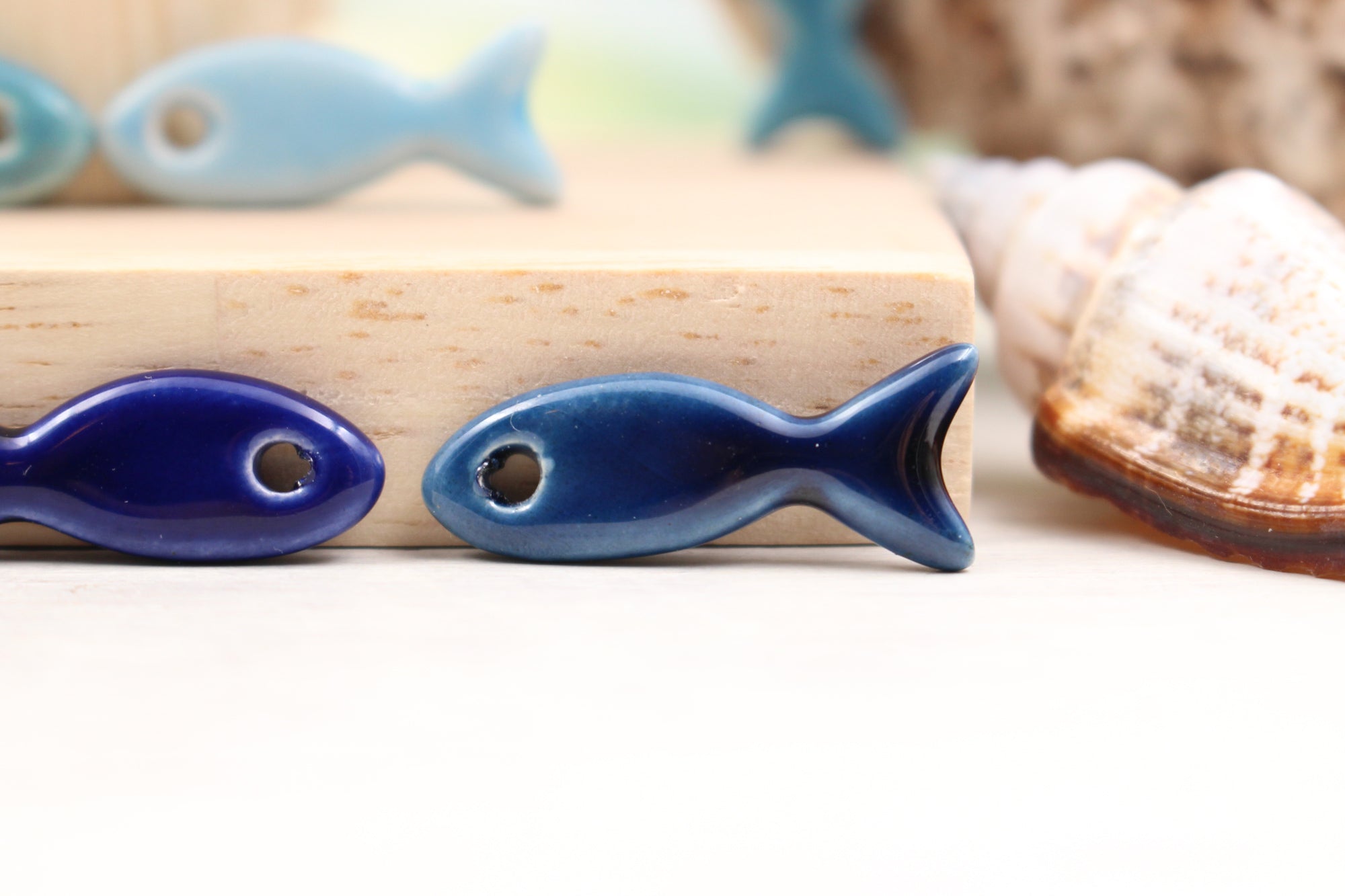 Ceramic fish charms for jewelry and accessories handmade in France by Alain Granell