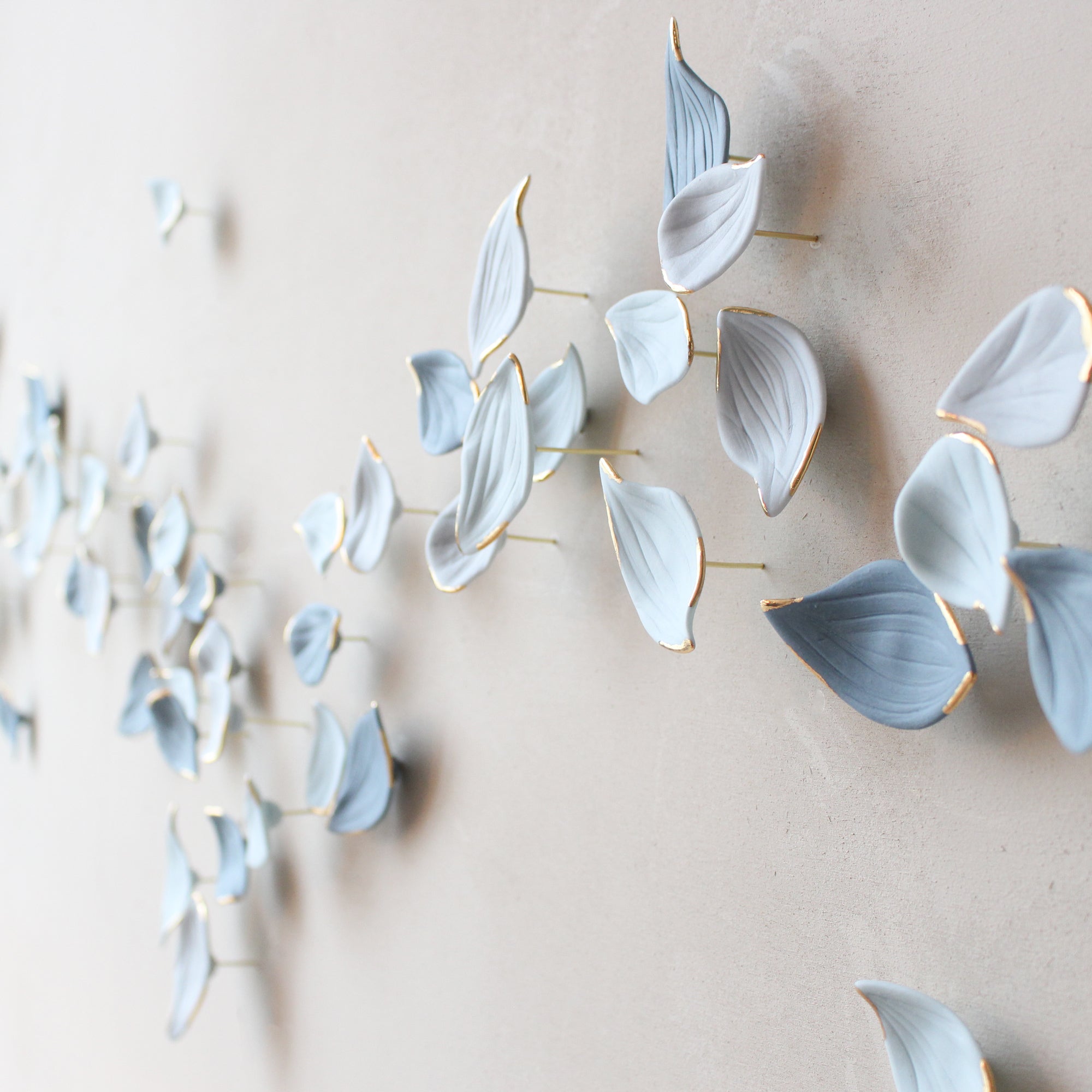 Blue Autumn is a Large porcelain wall art of Blue Leaves handmade in France by Alain Granell
