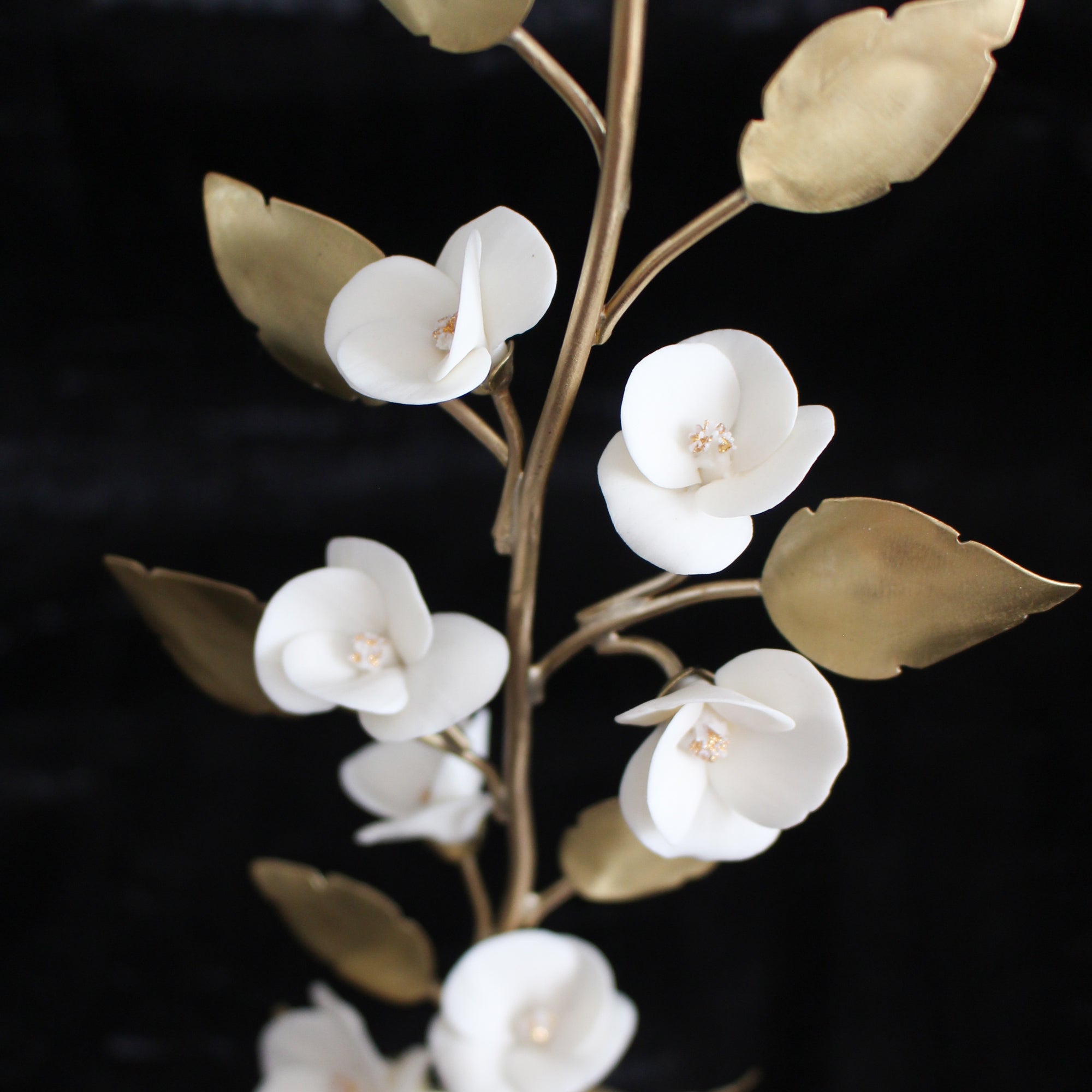 White porcelain flowers on Brass Tree by Alain Granell