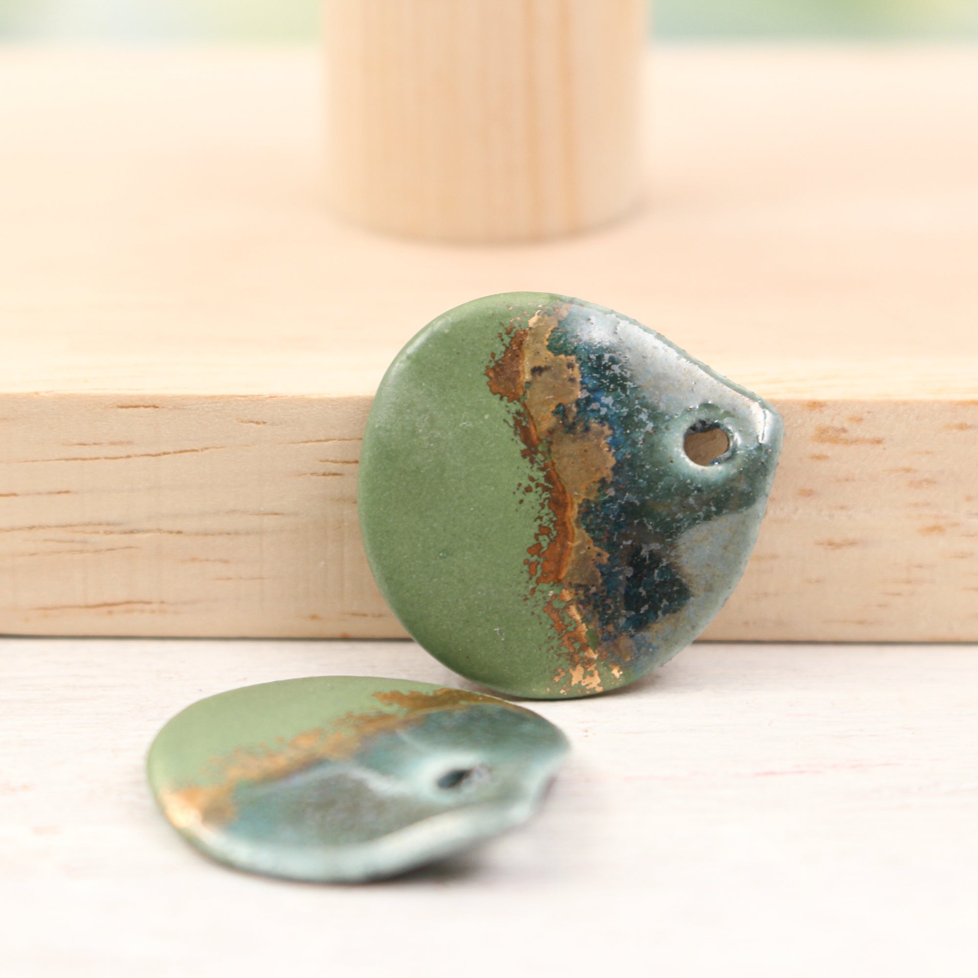 Multicolor ceramic and gold petal charms handmade in France by Alain Granell