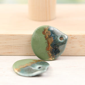 Multicolor ceramic and gold petal charms handmade in France by Alain Granell