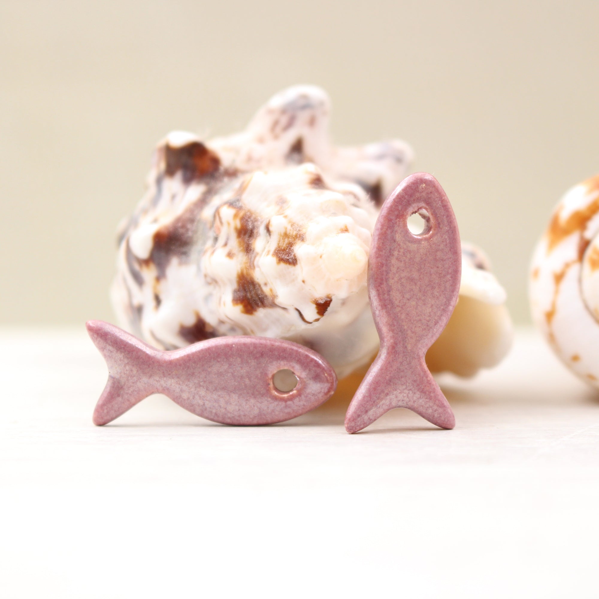 Ceramic fish charms for jewelry and accessories handmade in France by Alain Granell