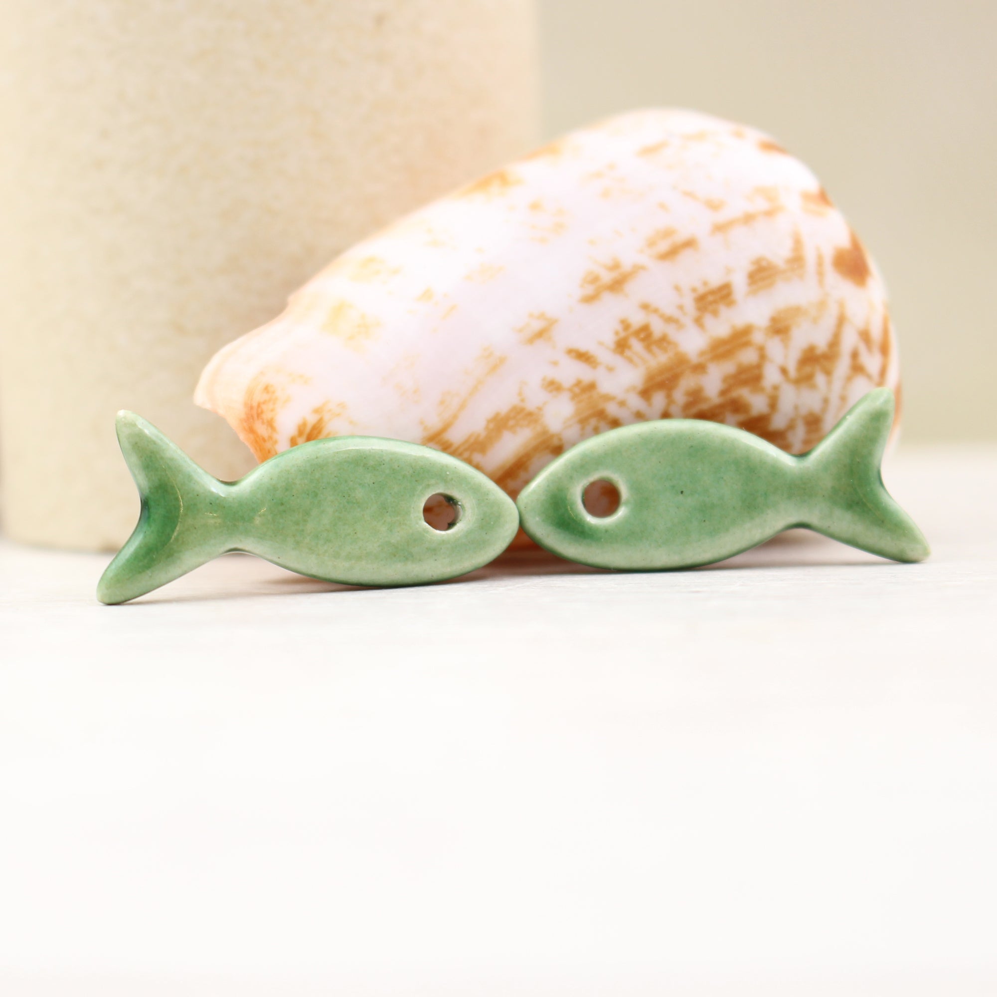 Ceramic fish charms for jewelry and accessories handmade in France by Alain Granell