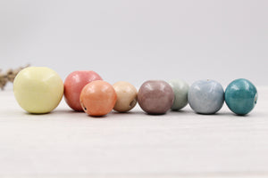 Handmade ceramic beads in various colors