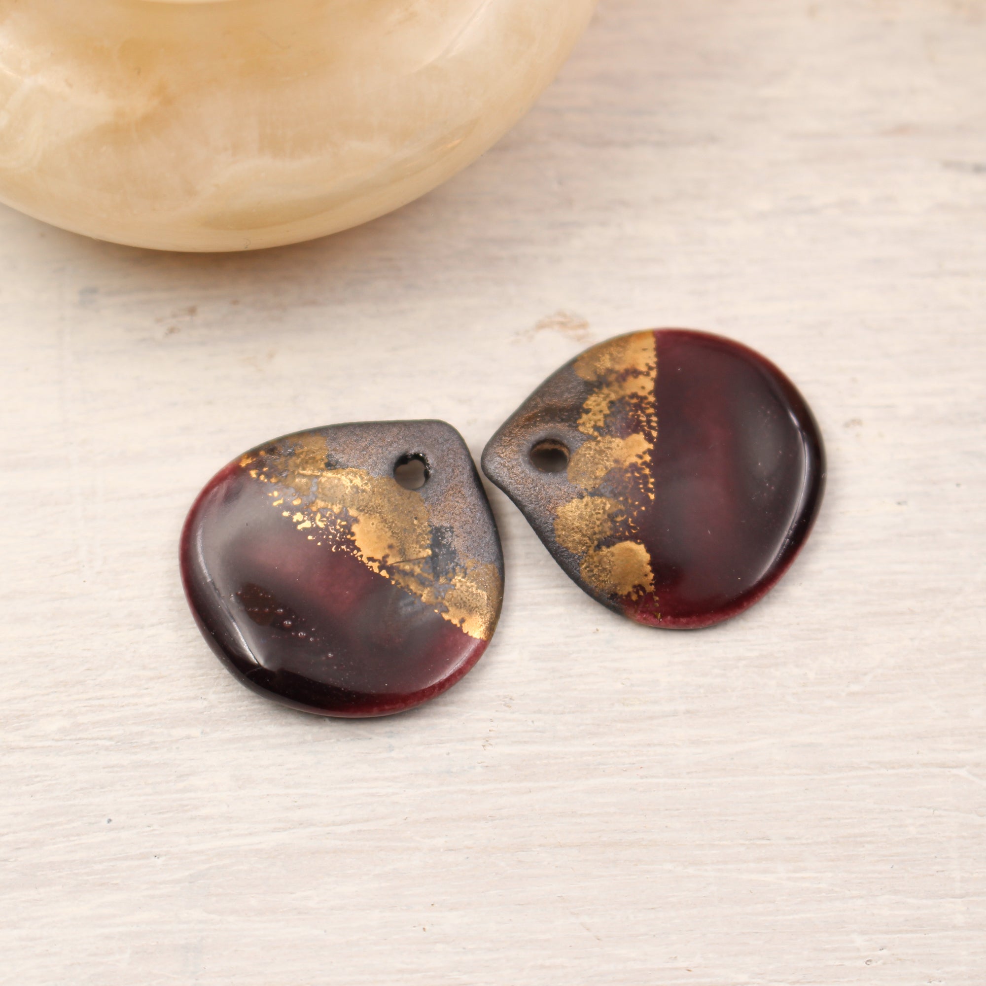 Multicolor ceramic and gold petal charms handmade in France by Alain Granell