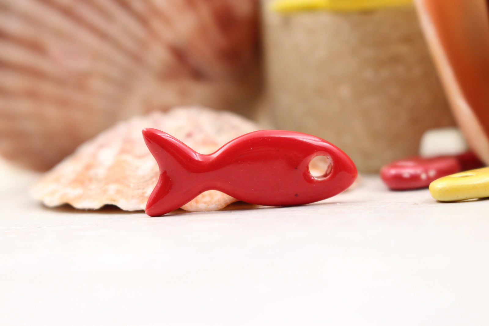 Ceramic fish charms for jewelry and accessories handmade in France by Alain Granell