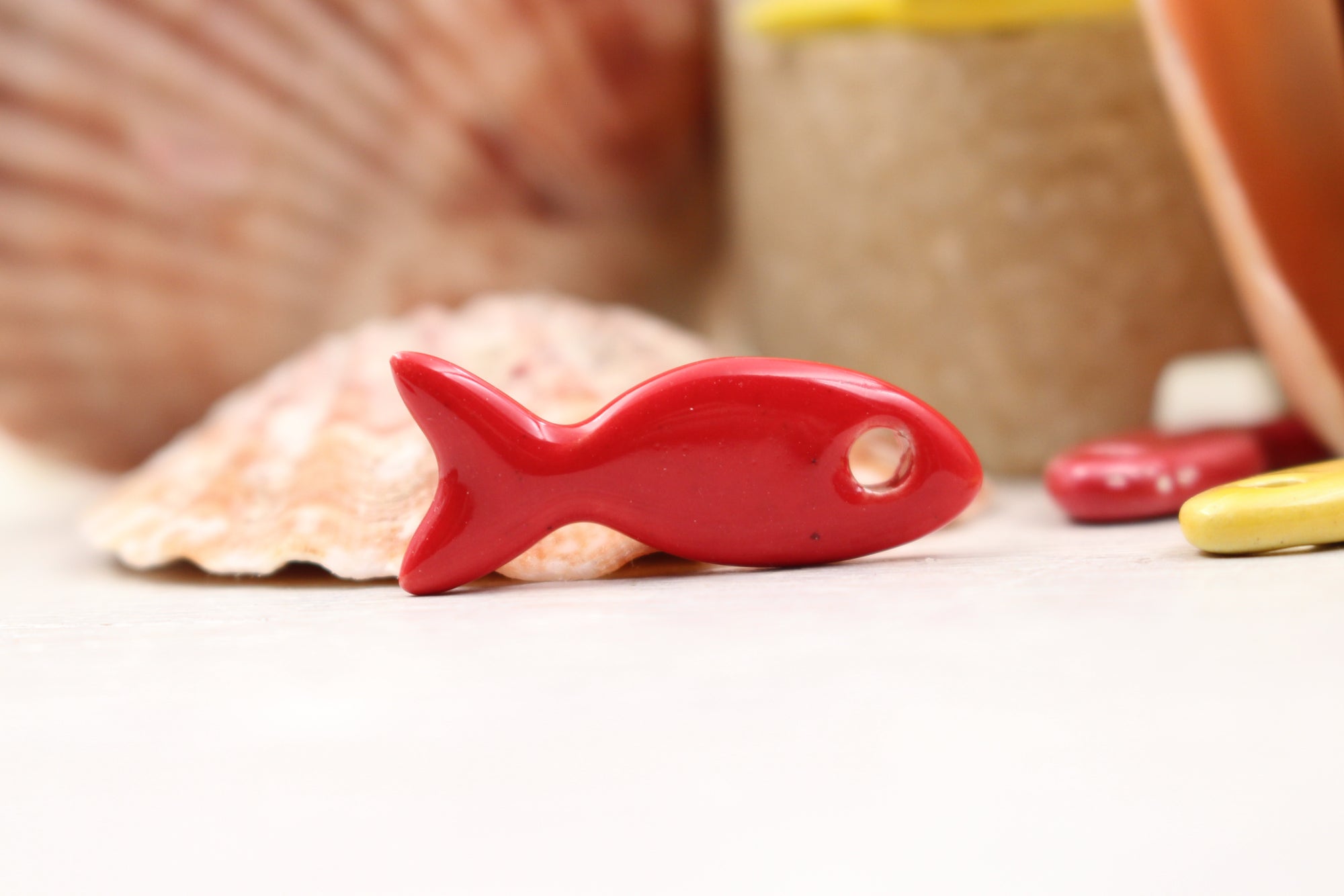 Ceramic fish charms for jewelry and accessories handmade in France by Alain Granell