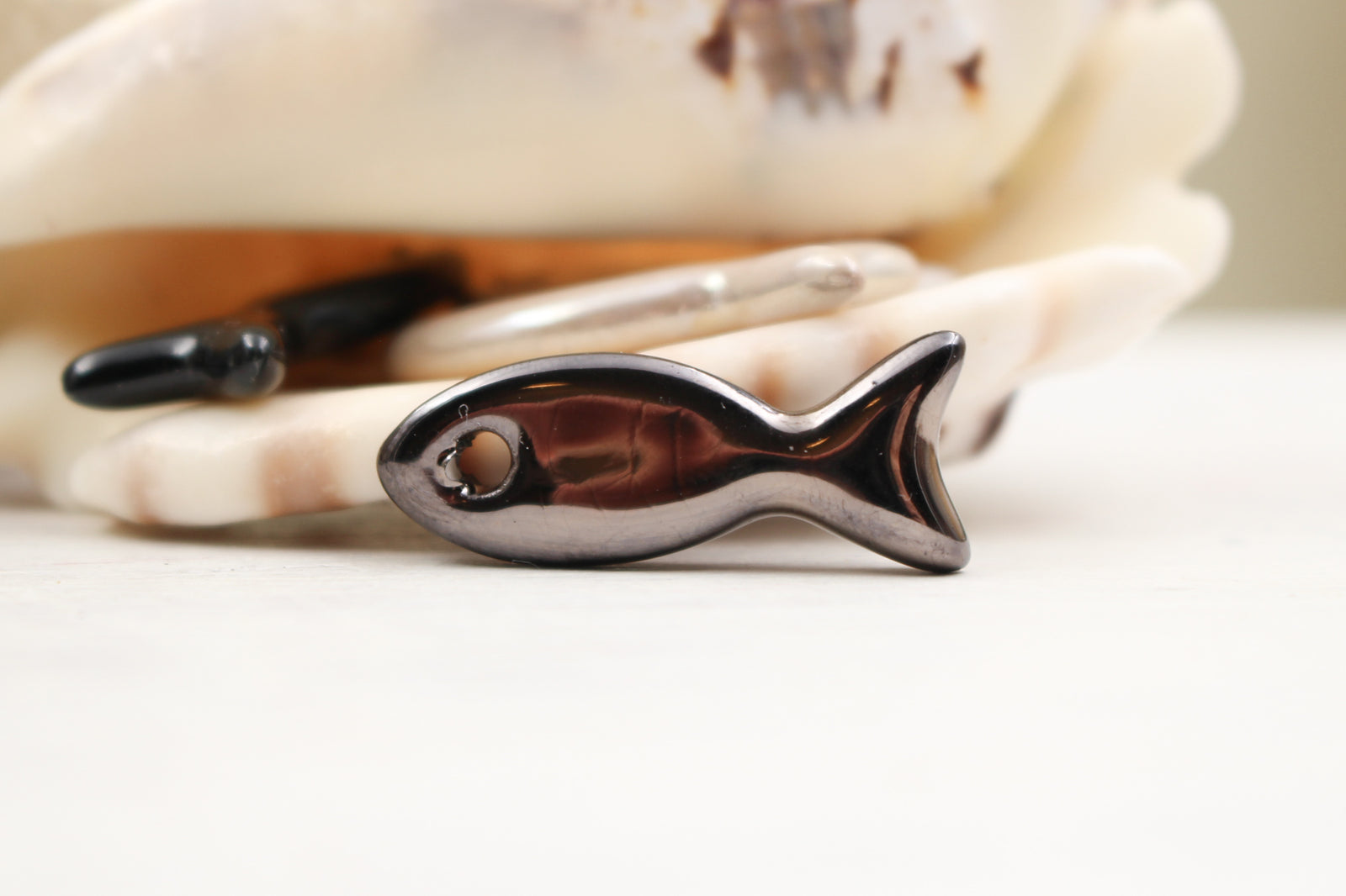 Ceramic fish charms for jewelry and accessories handmade in France by Alain Granell