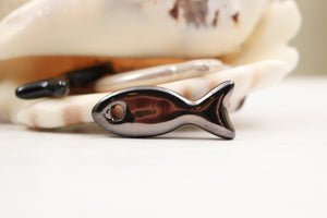 Ceramic fish charms for jewelry and accessories handmade in France by Alain Granell