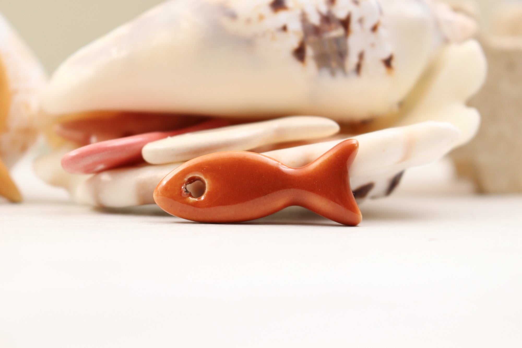 Ceramic fish charms for jewelry and accessories handmade in France by Alain Granell