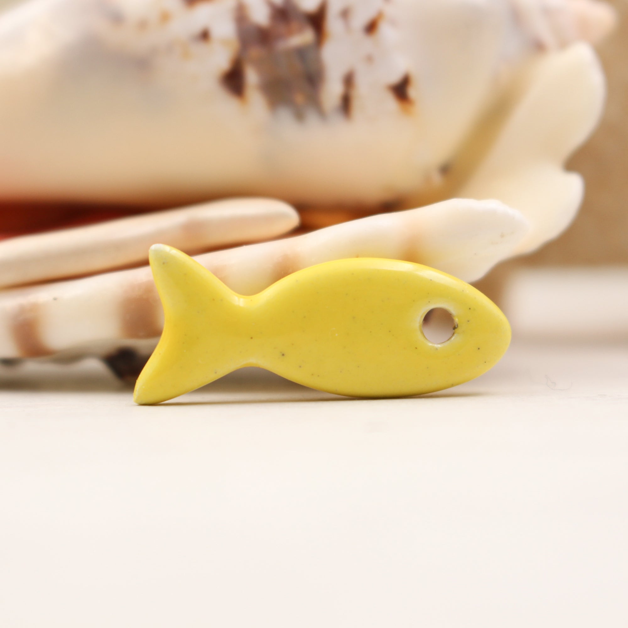 Ceramic fish charms for jewelry and accessories handmade in France by Alain Granell