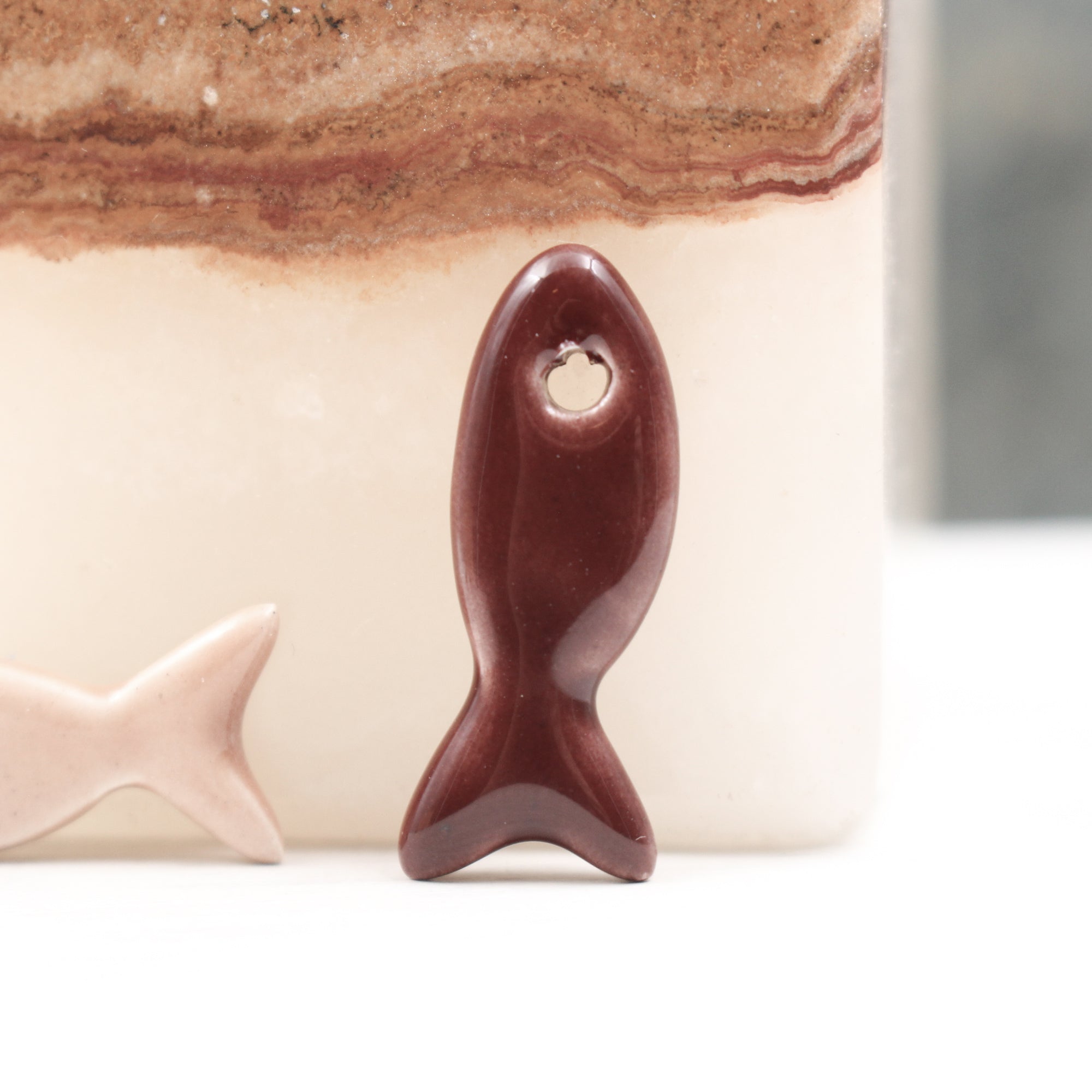 Ceramic fish charms for jewelry and accessories handmade in France by Alain Granell