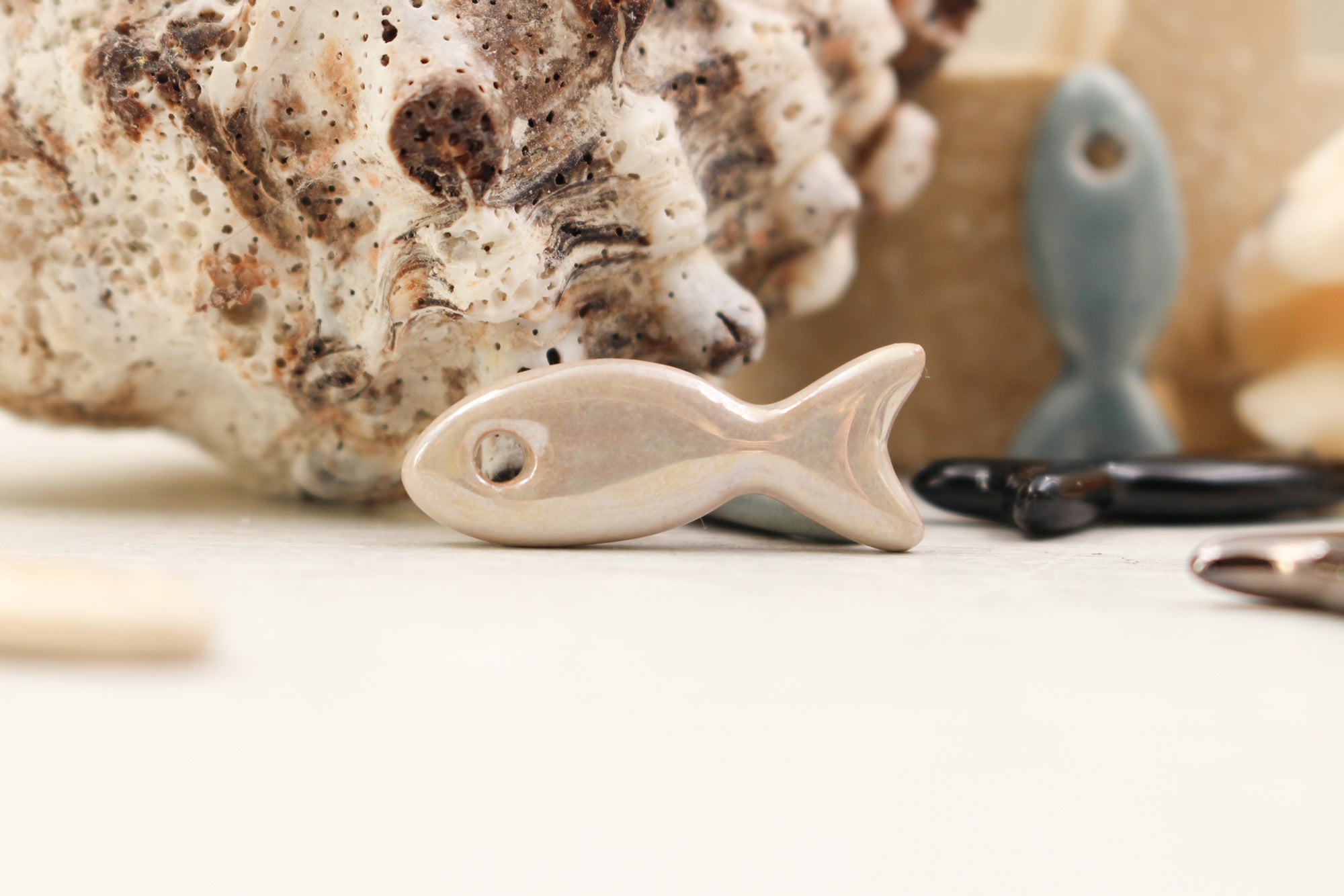 Ceramic fish charms for jewelry and accessories handmade in France by Alain Granell