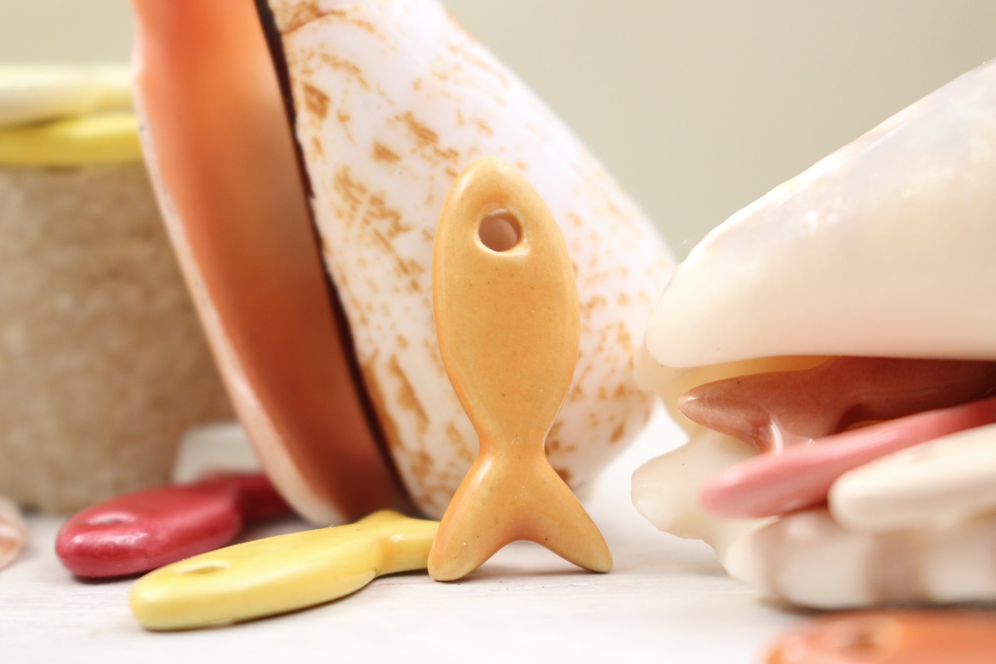 Ceramic fish charms for jewelry and accessories handmade in France by Alain Granell