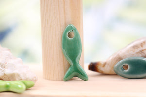 Ceramic fish charms for jewelry and accessories handmade in France by Alain Granell