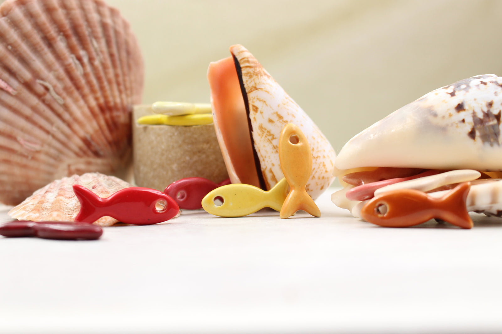 Ceramic fish charms for jewelry and accessories handmade in France by Alain Granell
